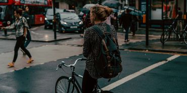 Woman riding bike on London street